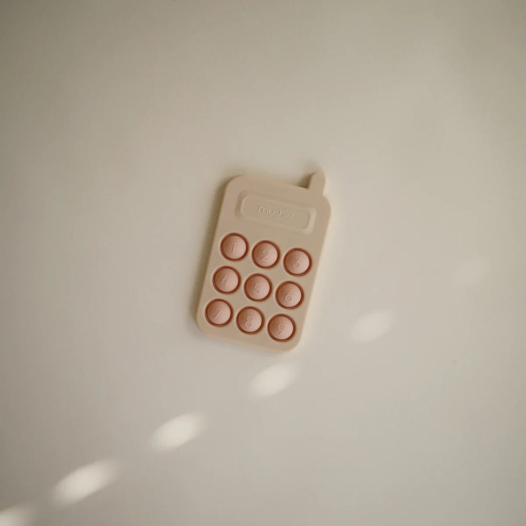 Mushie Phone Press Toy – Blush