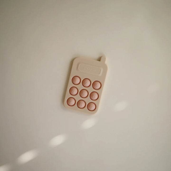 Mushie Phone Press Toy – Blush