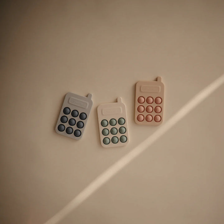 Mushie Phone Press Toy – Cambridge Blue